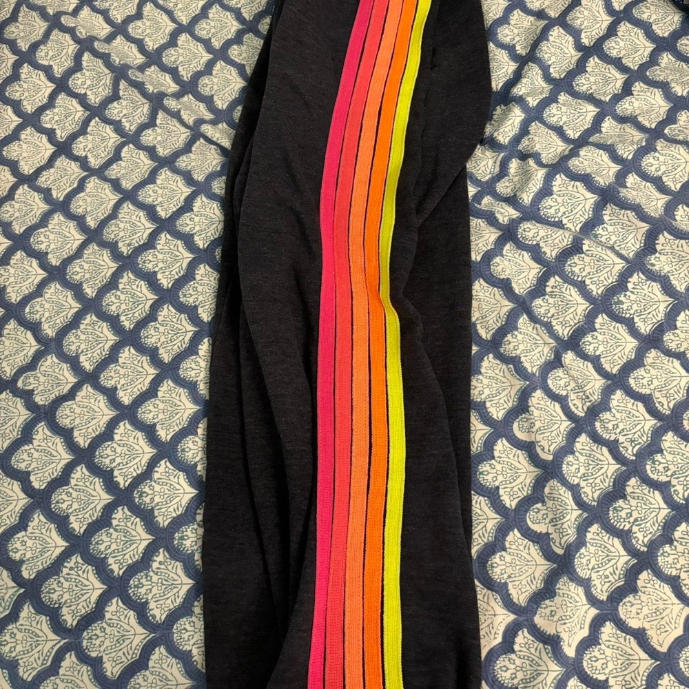 dark gray AV pants with colored stripes down side